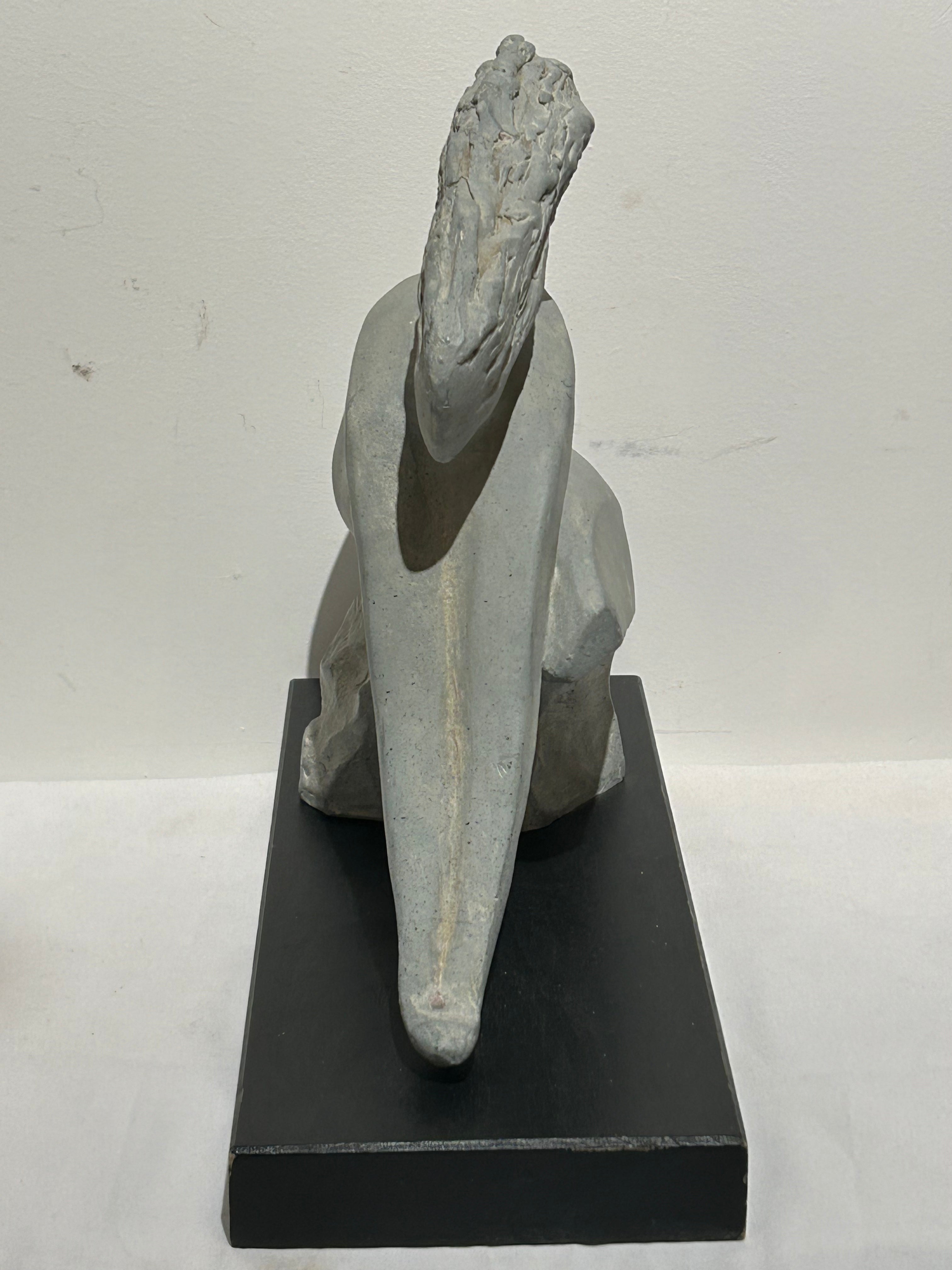 Vintage stone sculpture on wood