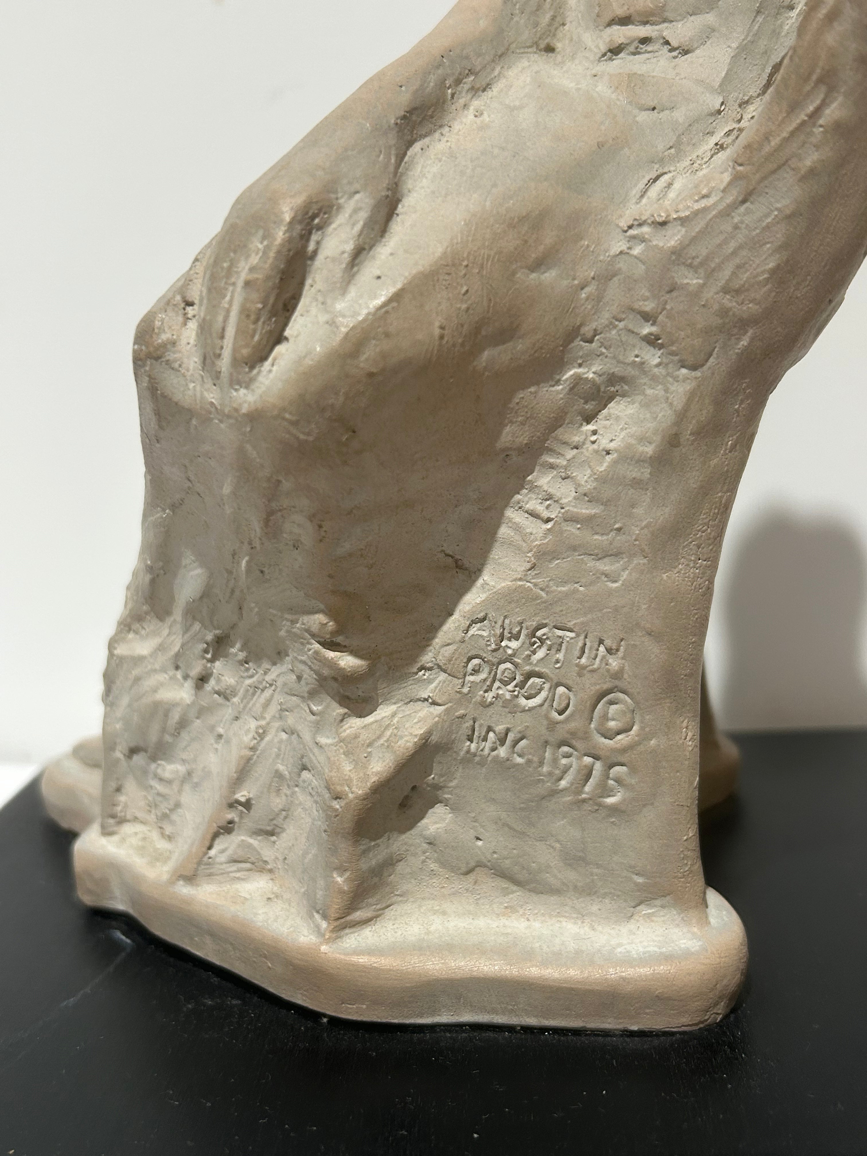 Vintage sitting figural sculpture on wood