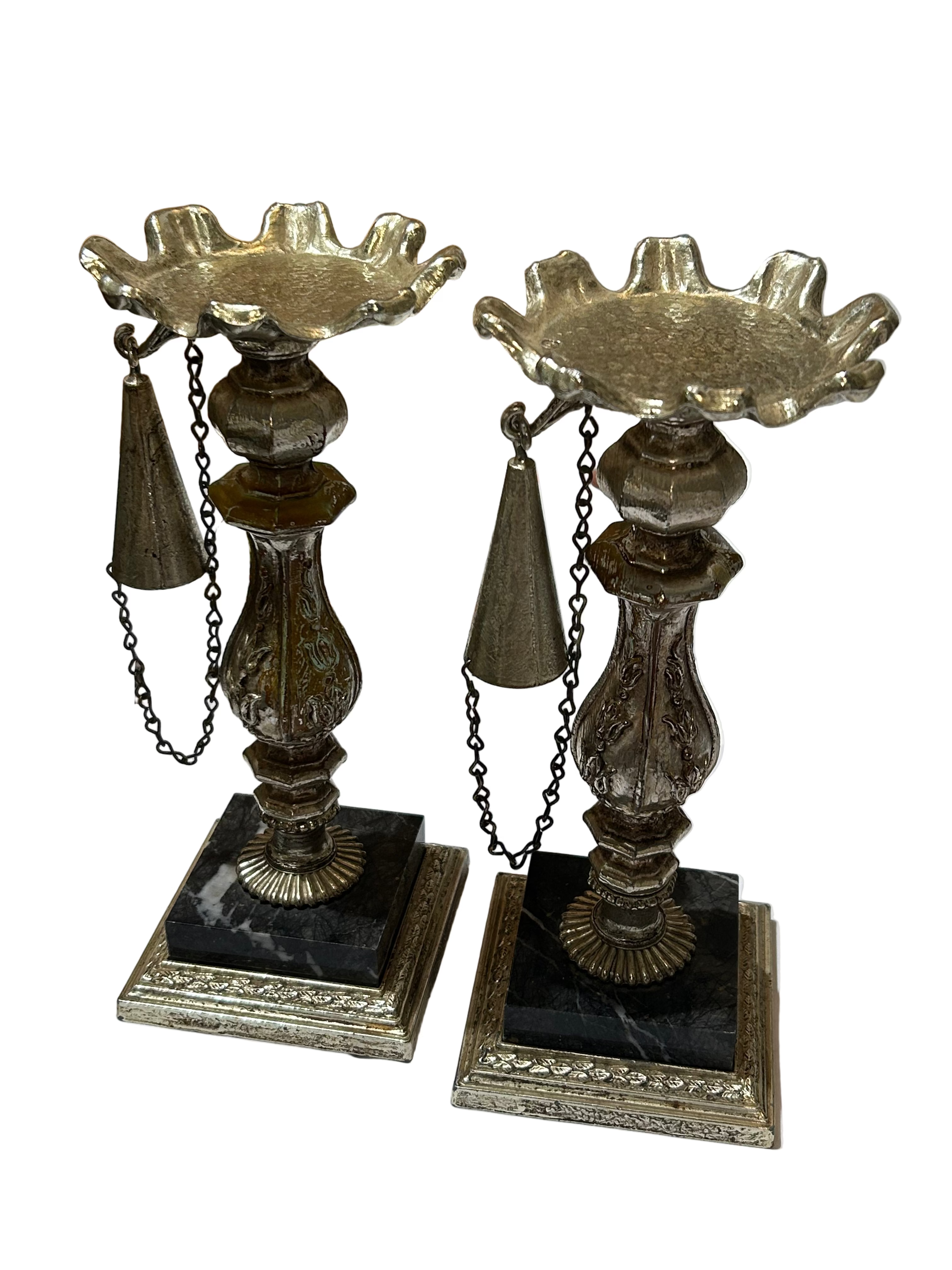 Vintage set of metal candleholders on marble bases