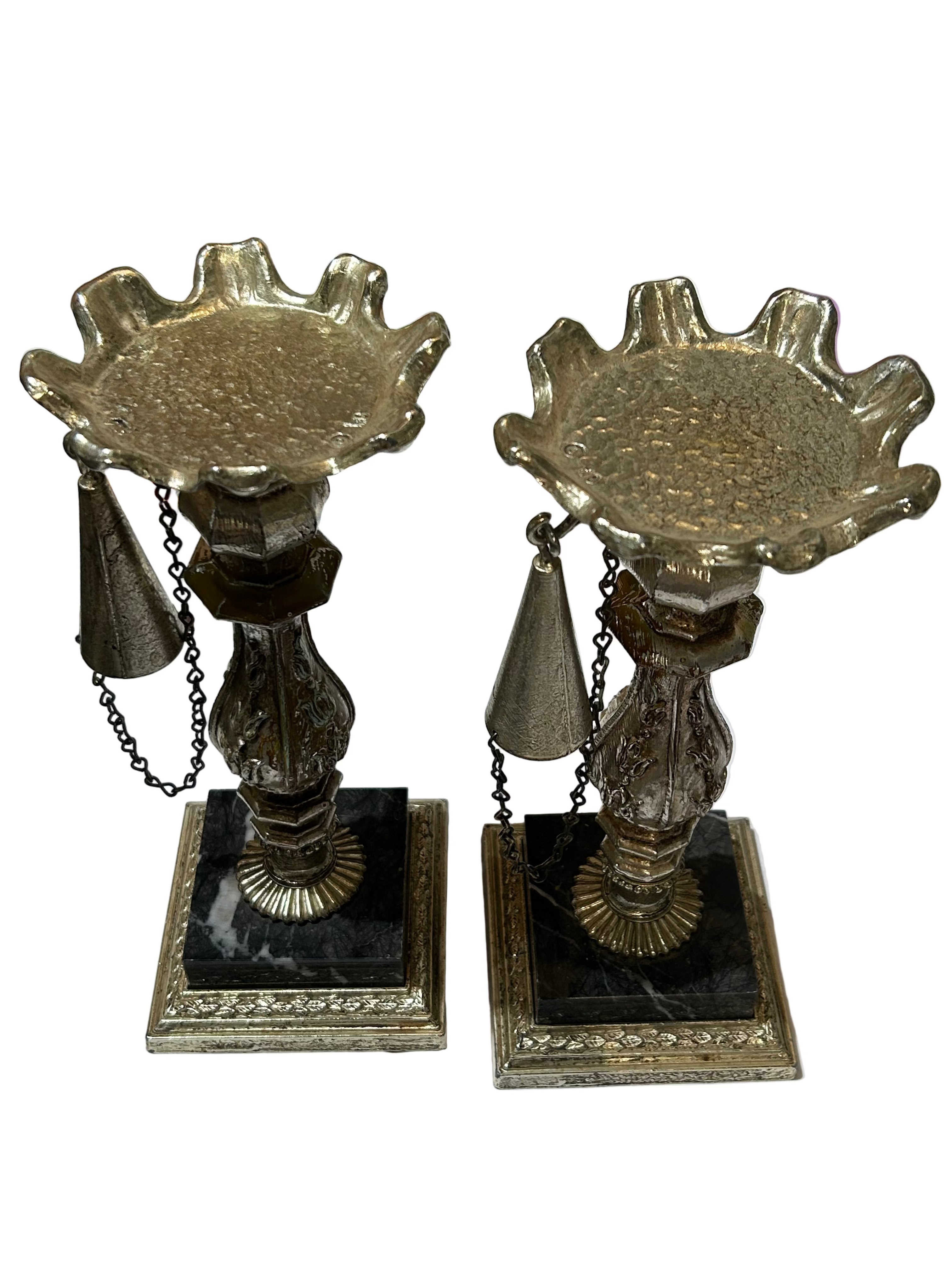 Vintage set of metal candleholders on marble bases