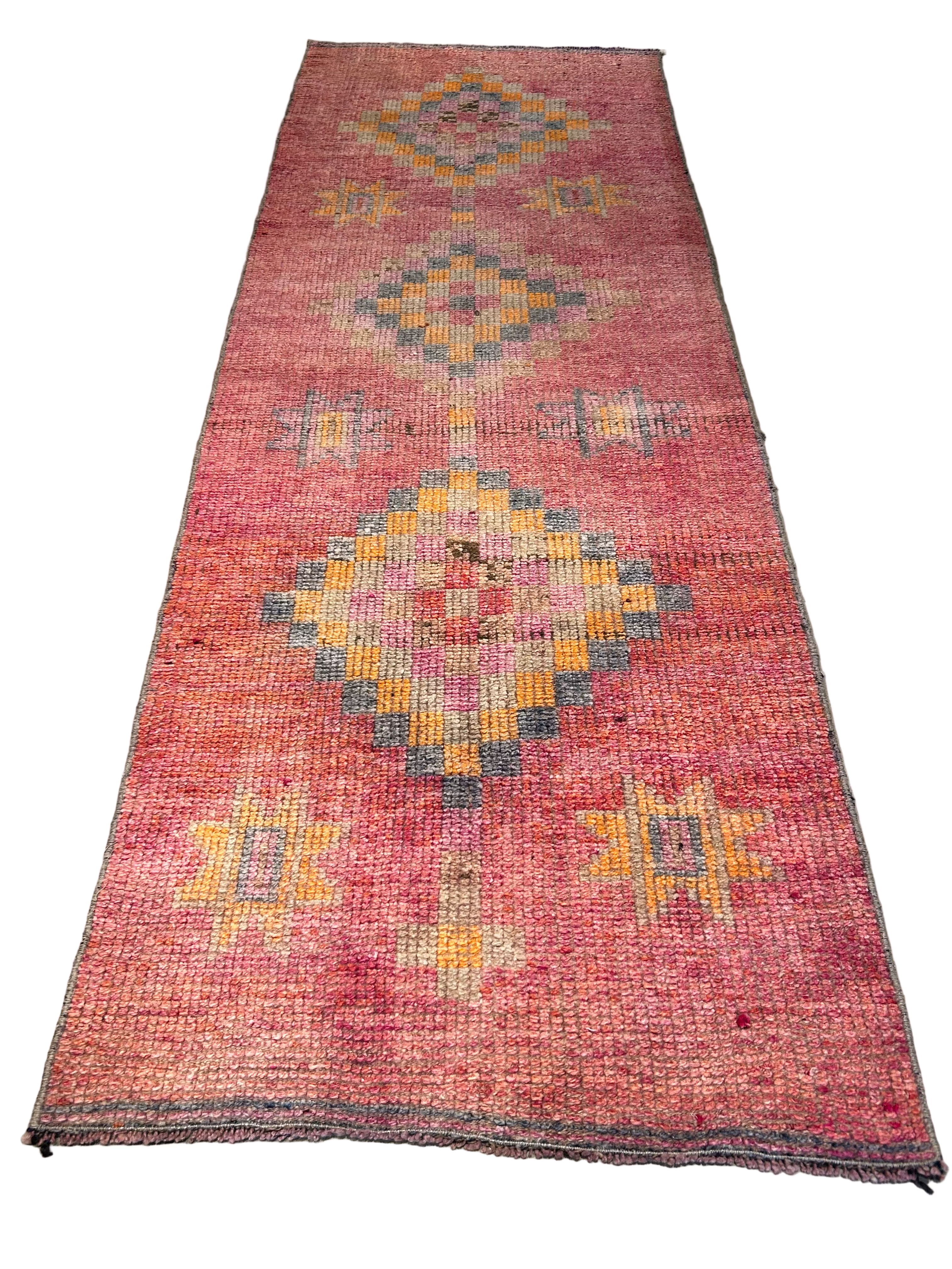 Vintage pink runner with diamond pattern