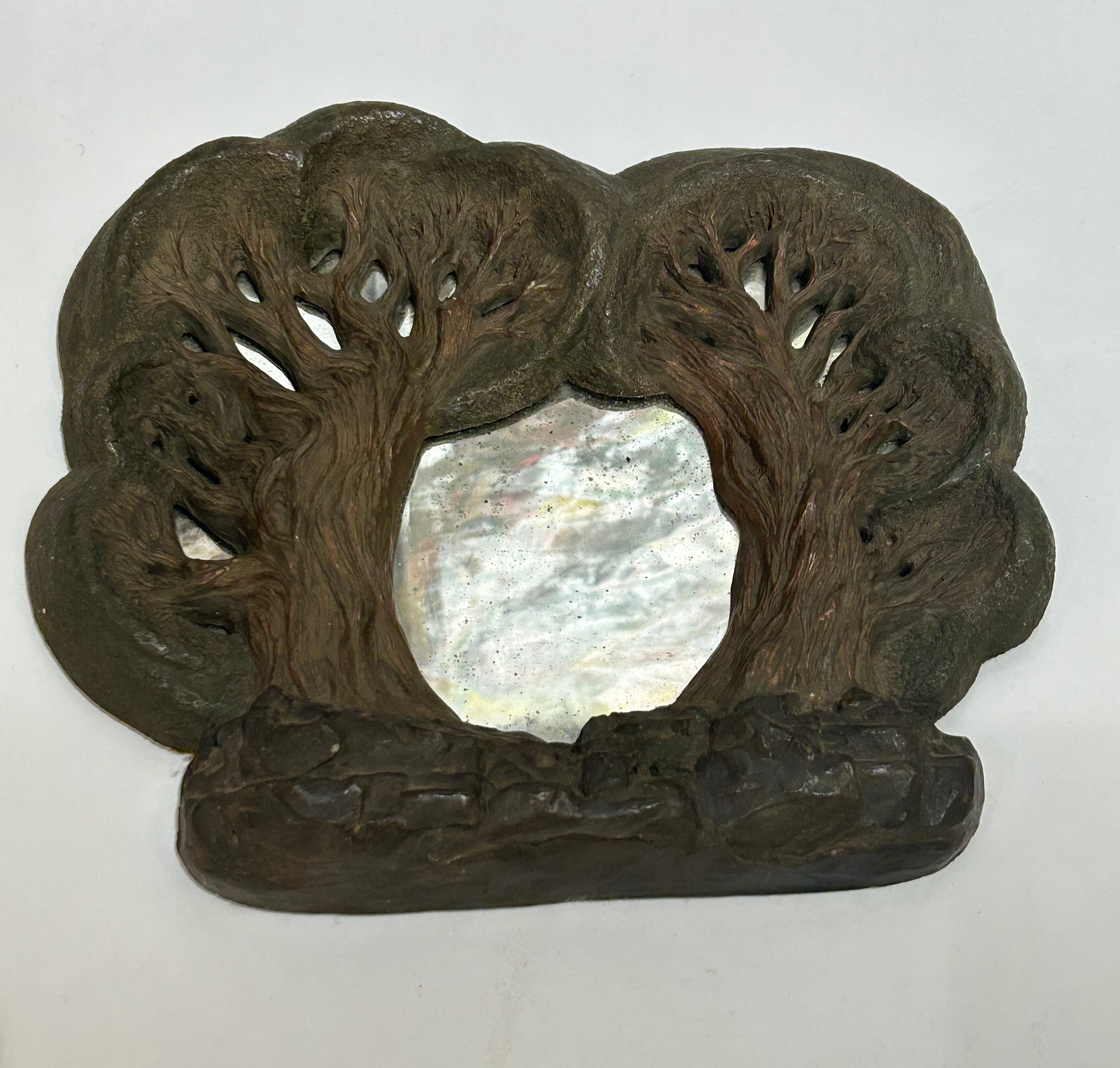 Vintage mirror with trees frame