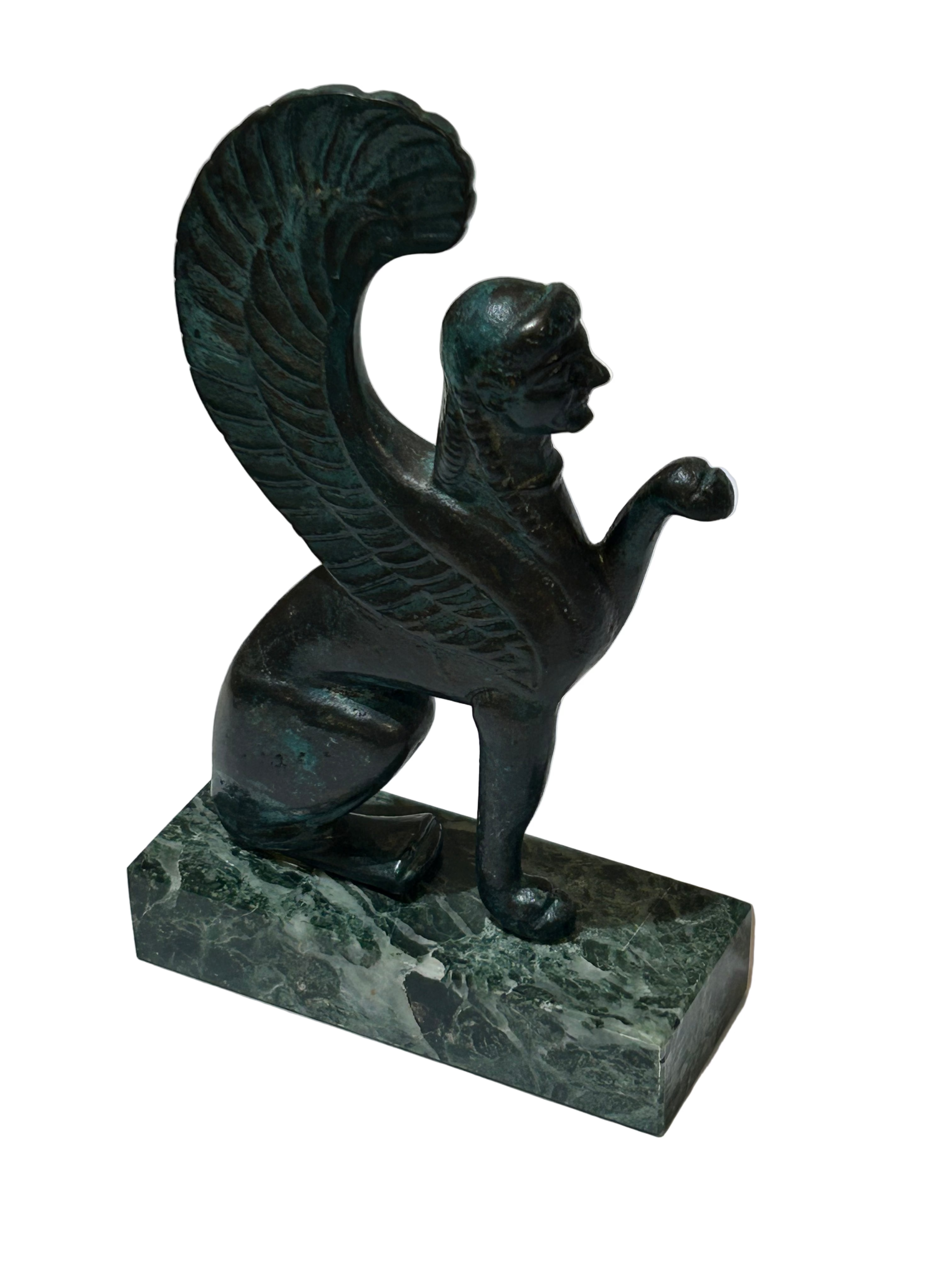Vintage small sphinx sculpture on marble
